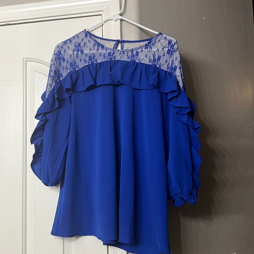 Blue ruffle top with sheer shoulder